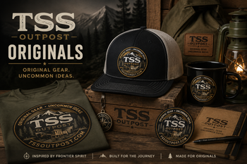 TSS Outpost Originals collection image featuring a branded snapback hat, logo t-shirt, camp mug, collectible patch, and notebook in a rustic mountain setting with the tagline Original Gear. Uncommon Ideas.